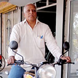 rajan_motorcycle Rajan on his leprosy ulcer treatment round.